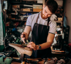 Picture of a cobbler repairing shoes Picture of a cobbler repairing shoes